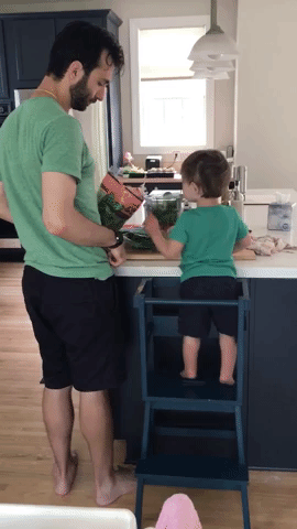 Father and son making a green smoothie gif.